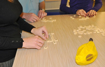 Baudville Employees Playing Bananagrams