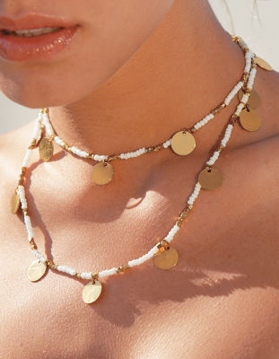 Gold coin necklace.