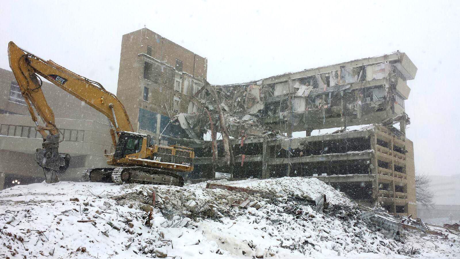 Cat Excavator performing demolition work