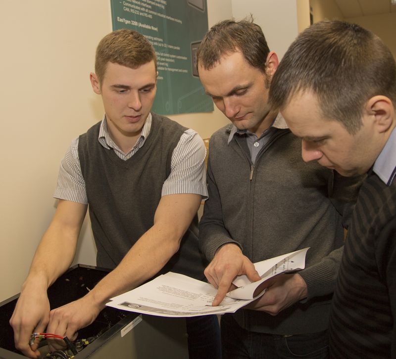 People from Autex working with an alternator image