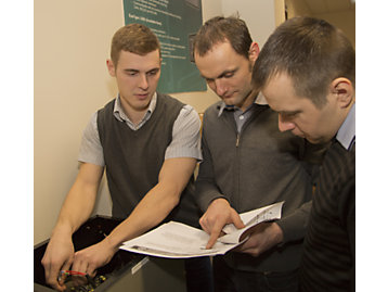 People from Autex working with an alternator image