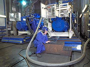 Engineer in testing area on a computer