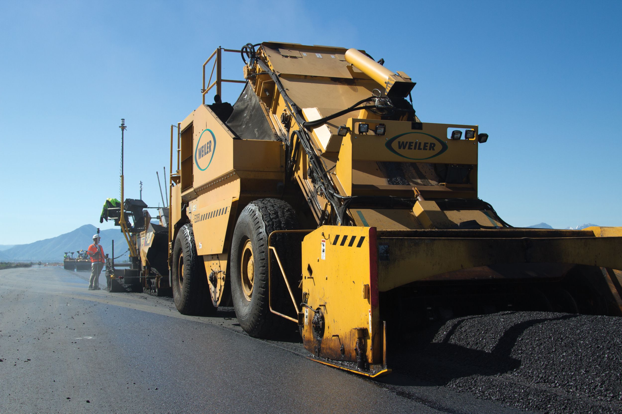 Two Weiler E2850 Remixing Transfer Vehicles (RTVs) were paired with the Cat pavers to ensure smooth, consistent paving.