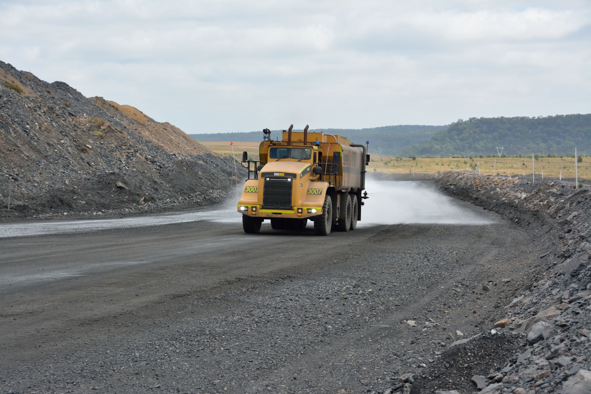 Dust is effectively minimized for better visibility and safer operation by the Haulmax 3900 support trucks with Kador water tanks.