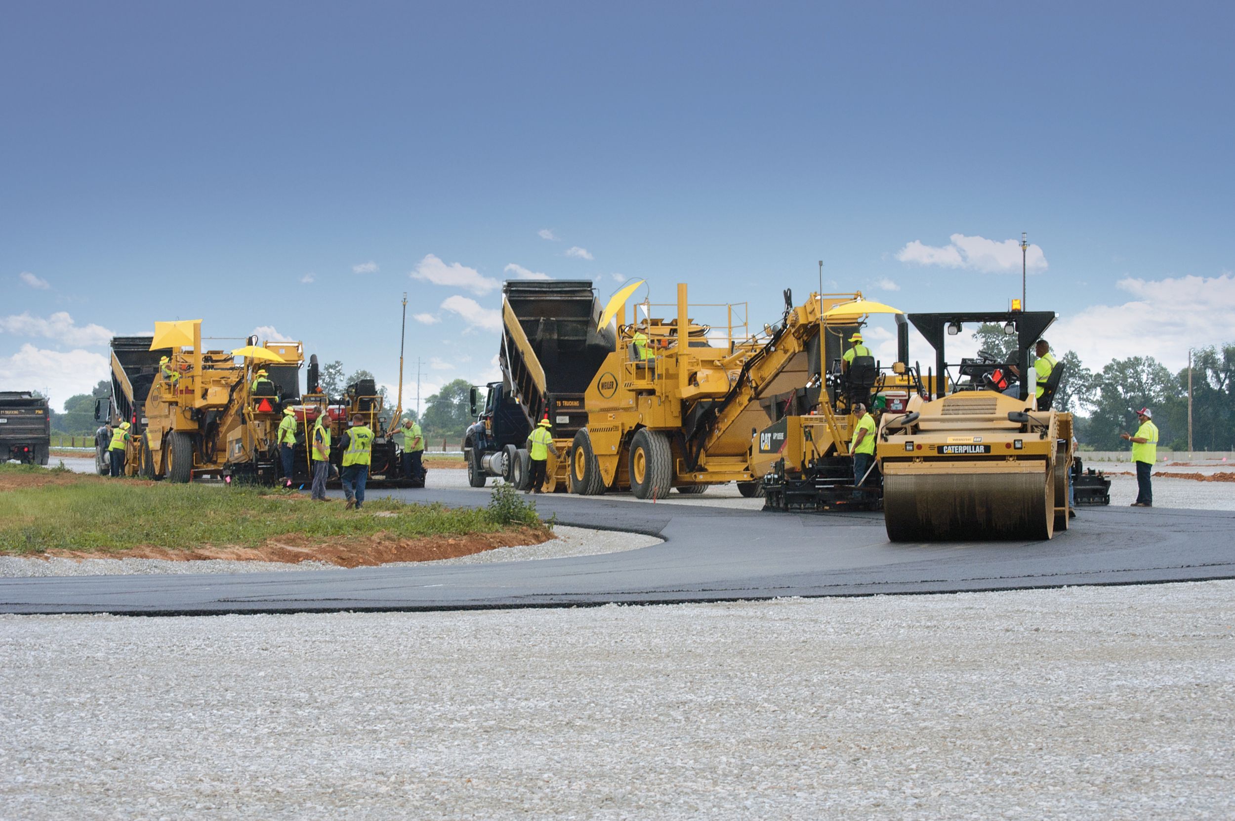 The paving train moved continuously to help achieve smoothness targets.