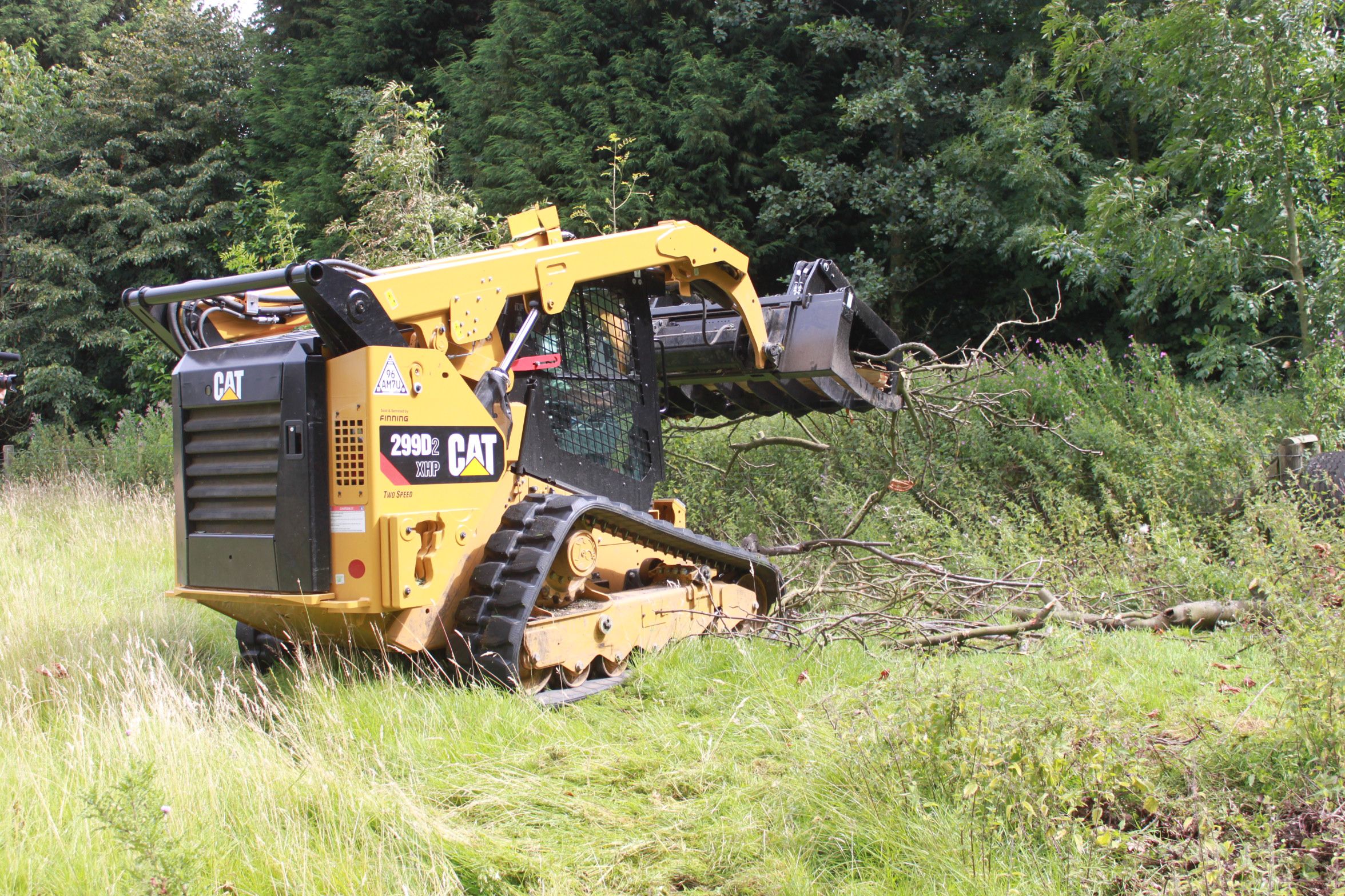 “I saw the 299D2 XHP as a tool carrier, plain and simple. We saw it as having great capacity, because of the range of tools that we could put on it – in addition to those we needed for the forestry.” – Charles Wake