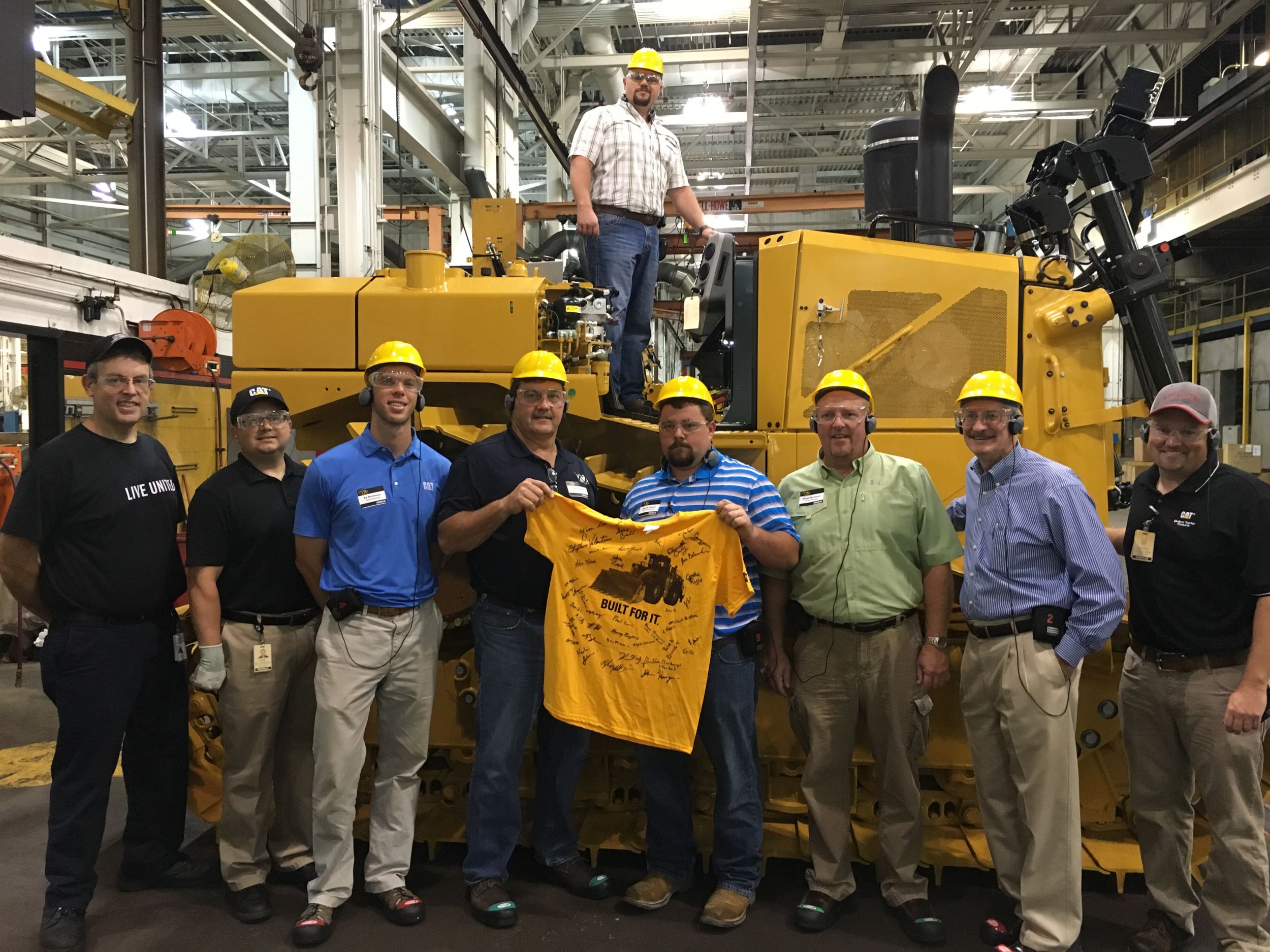 Santek’s employees received a T-shirt signed by Caterpillar employees who helped build the company’s new D6T at the East Peoria Dozer facility.