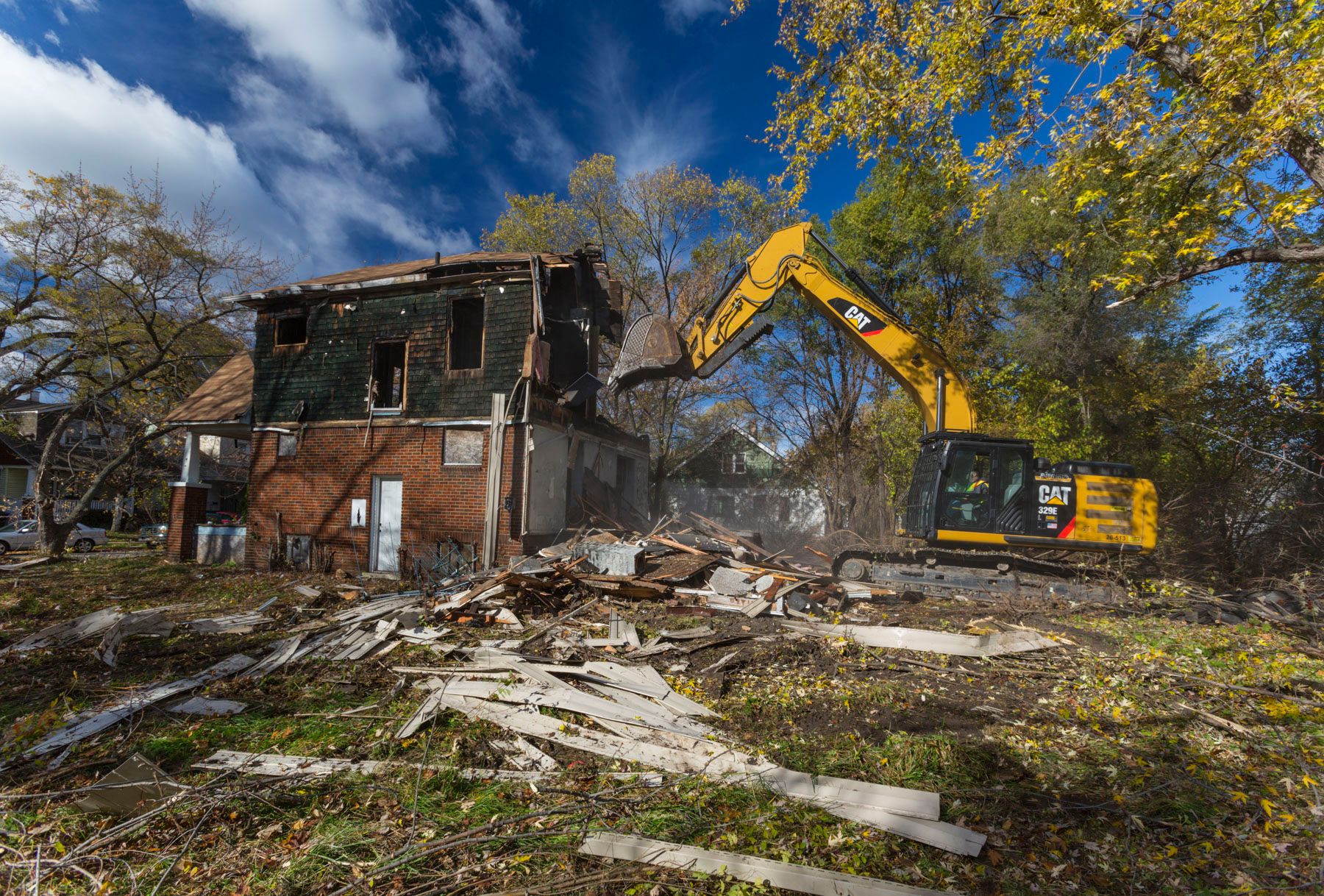 Adamo Group using a Cat® 329E hydraulic excavator to help improve neighborhoods through urban removal.