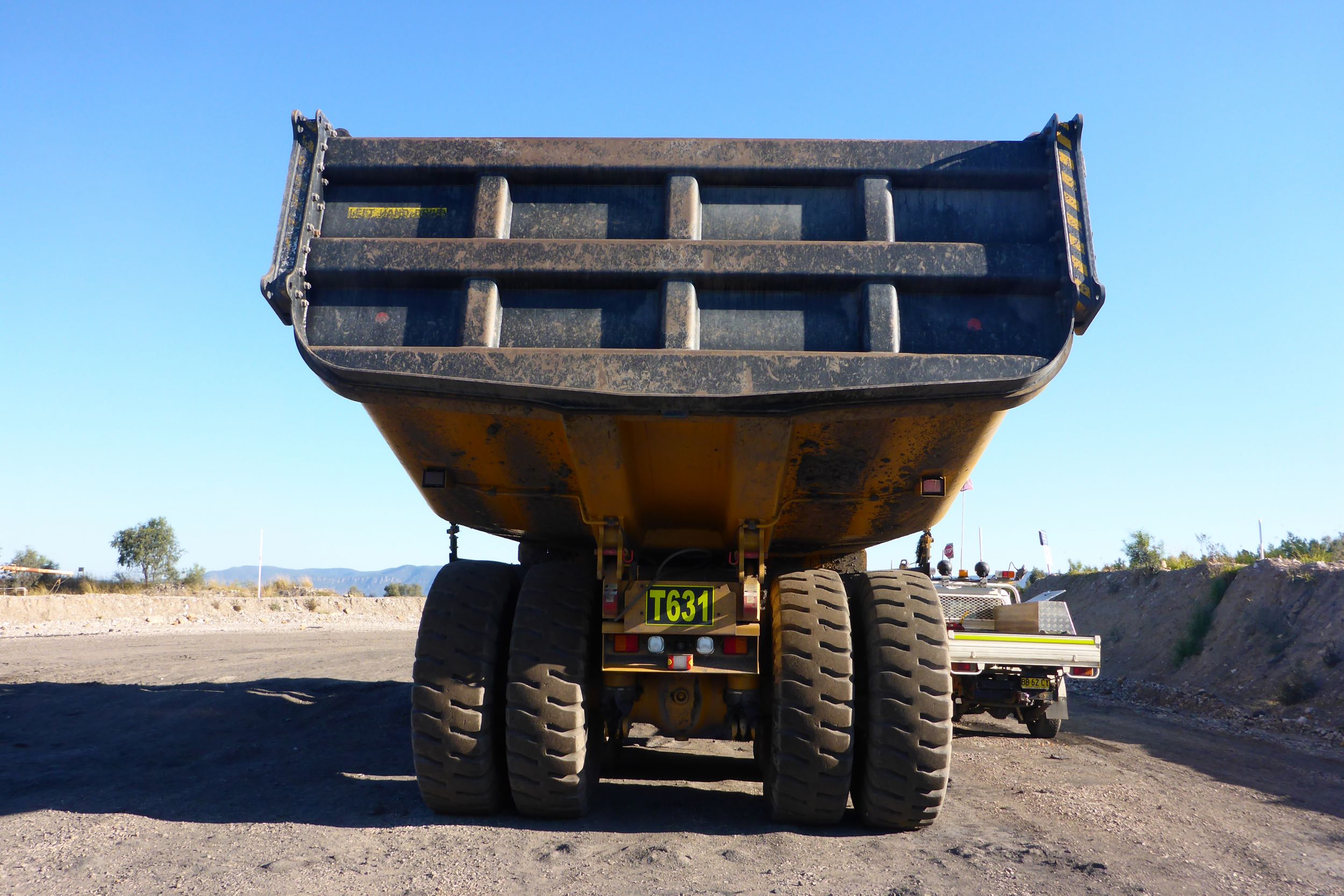 “Their rigid, eight-meter long by 4.9 meter bodies enable them to be loaded in two passes right at the coal face using a large-mouth loader bucket, without any rehandling.”