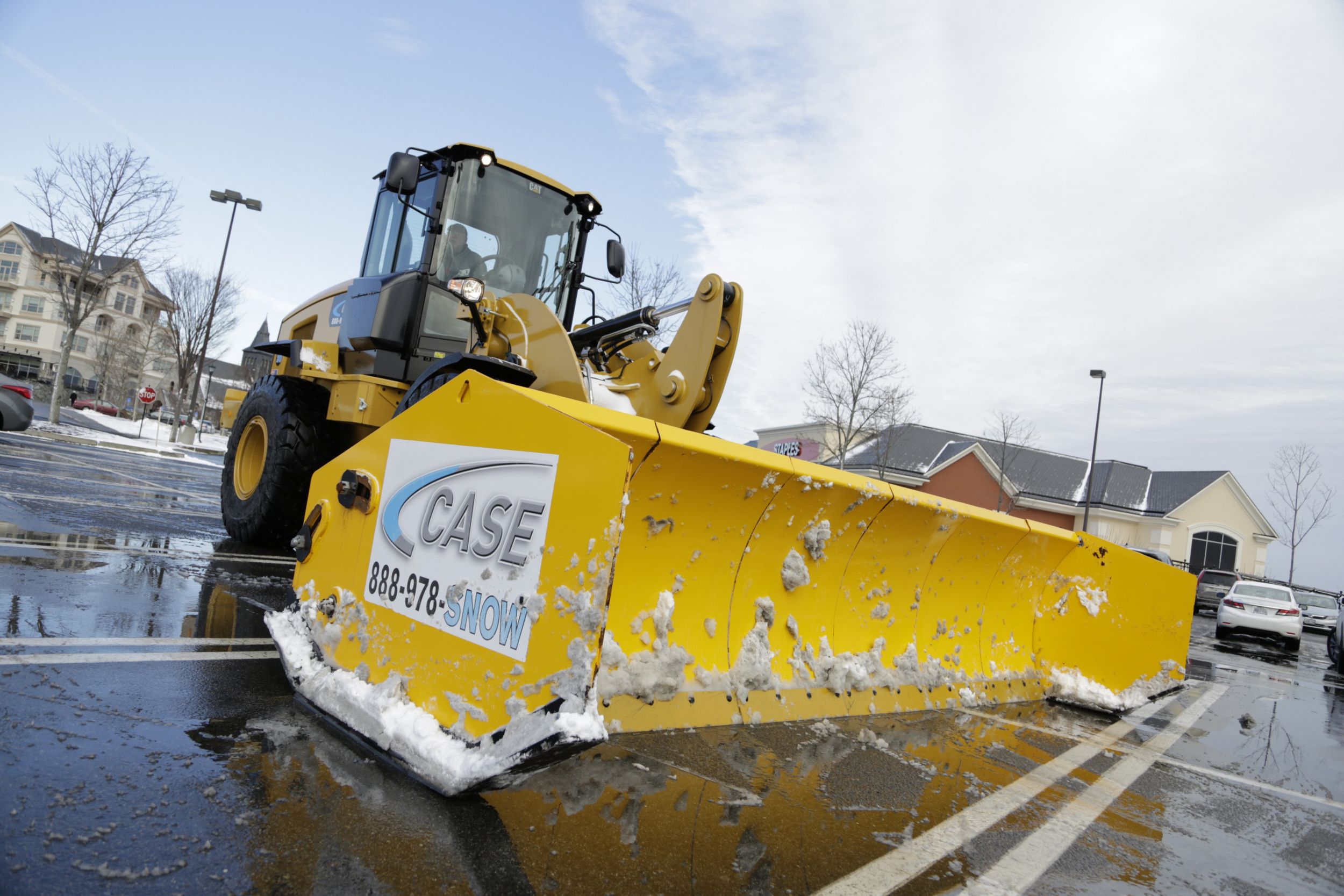 One of Case Snow Management’s Cat® Wheel Loaders parked in a freshly plowed lot.