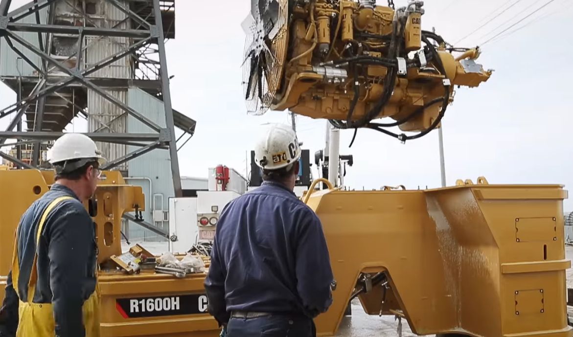 The Cat® C11 ACERT™ engine gets lifted in the air before being sent underground