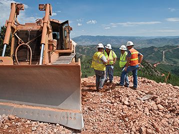 Dozer with workers