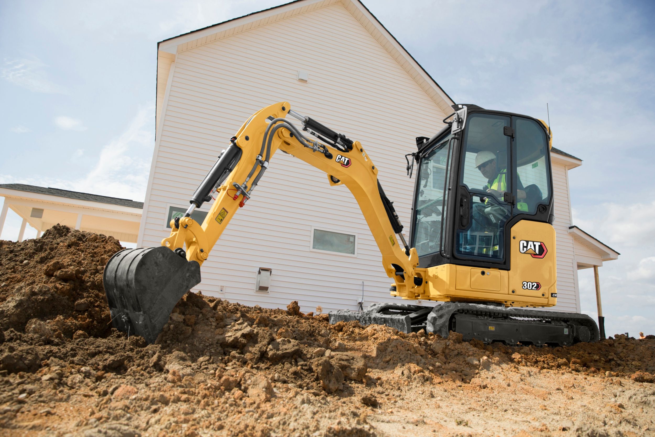 Cat's New Mini Excavator Accepts Skid Steer Attachments