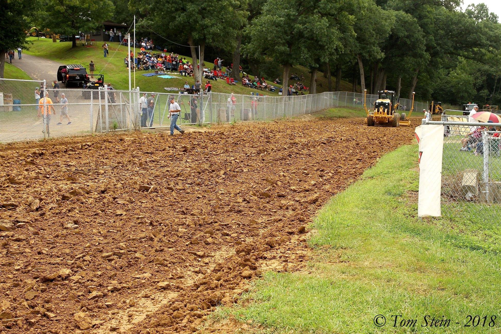 With fans already in place and practice nearing, the track surface starts to take shape.