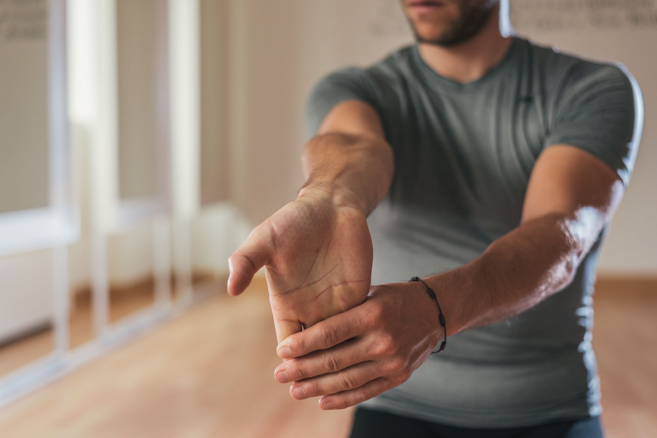 Photo of someone doing a wrist stretch