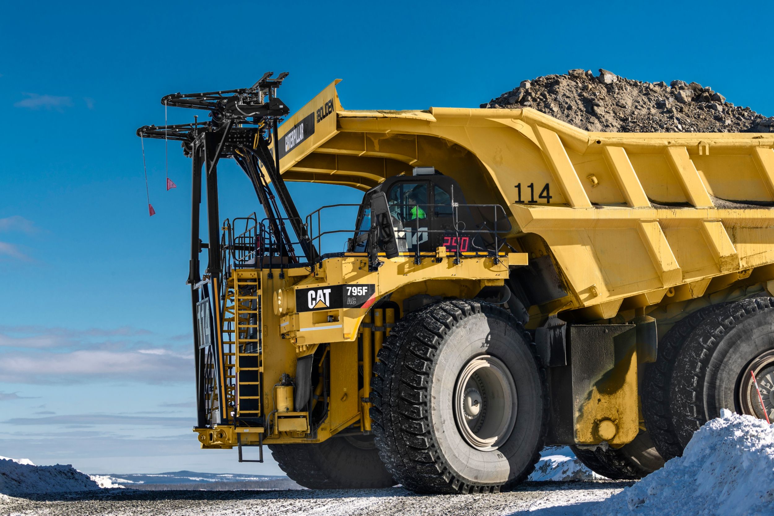 Cat 795 AC mining truck on trolley at Boliden Aitik mine