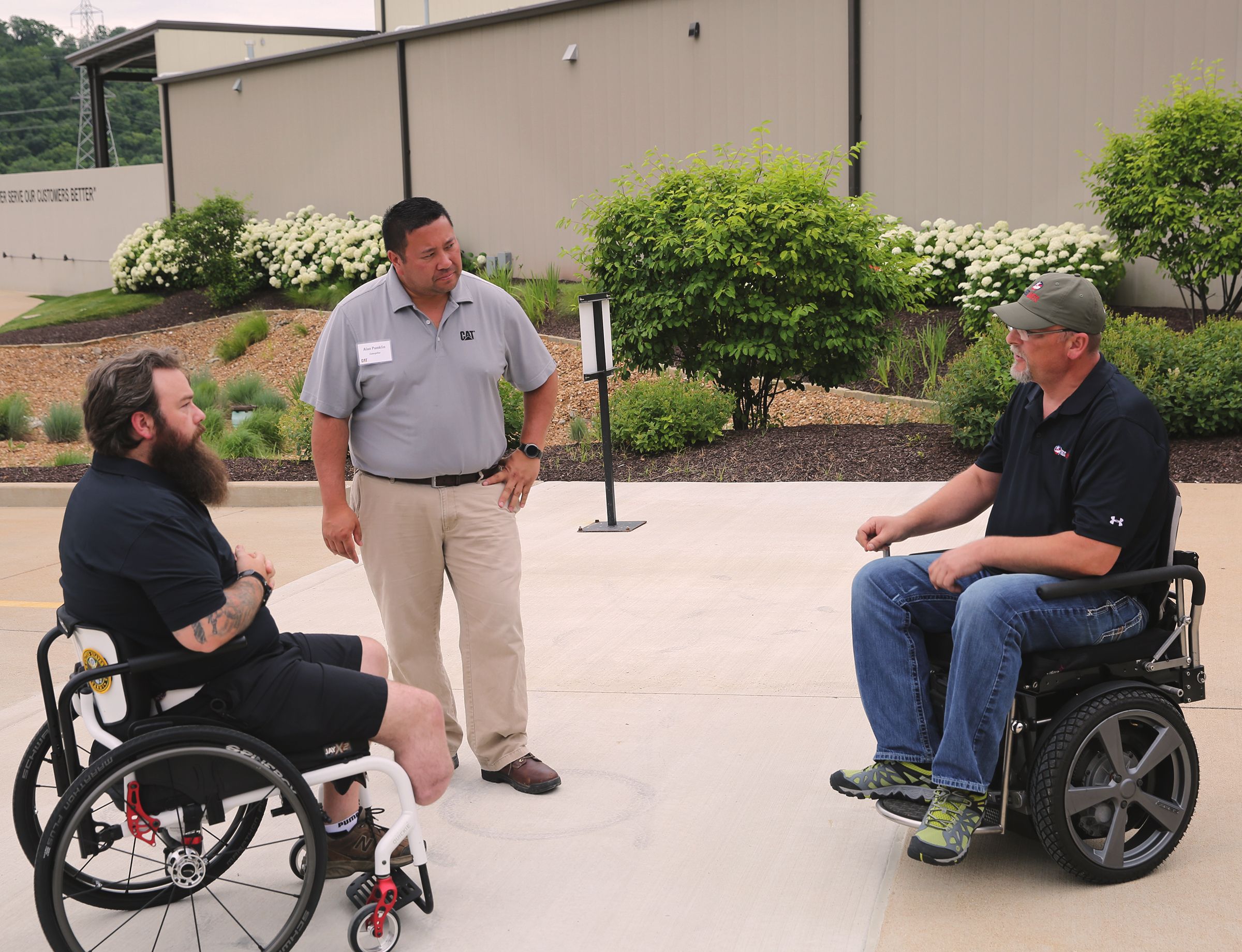 Alan Pumklin, Caterpillar system application representative, gets feedback from Segs4Vets members on the Cat<sup>®</sup> Command technology.