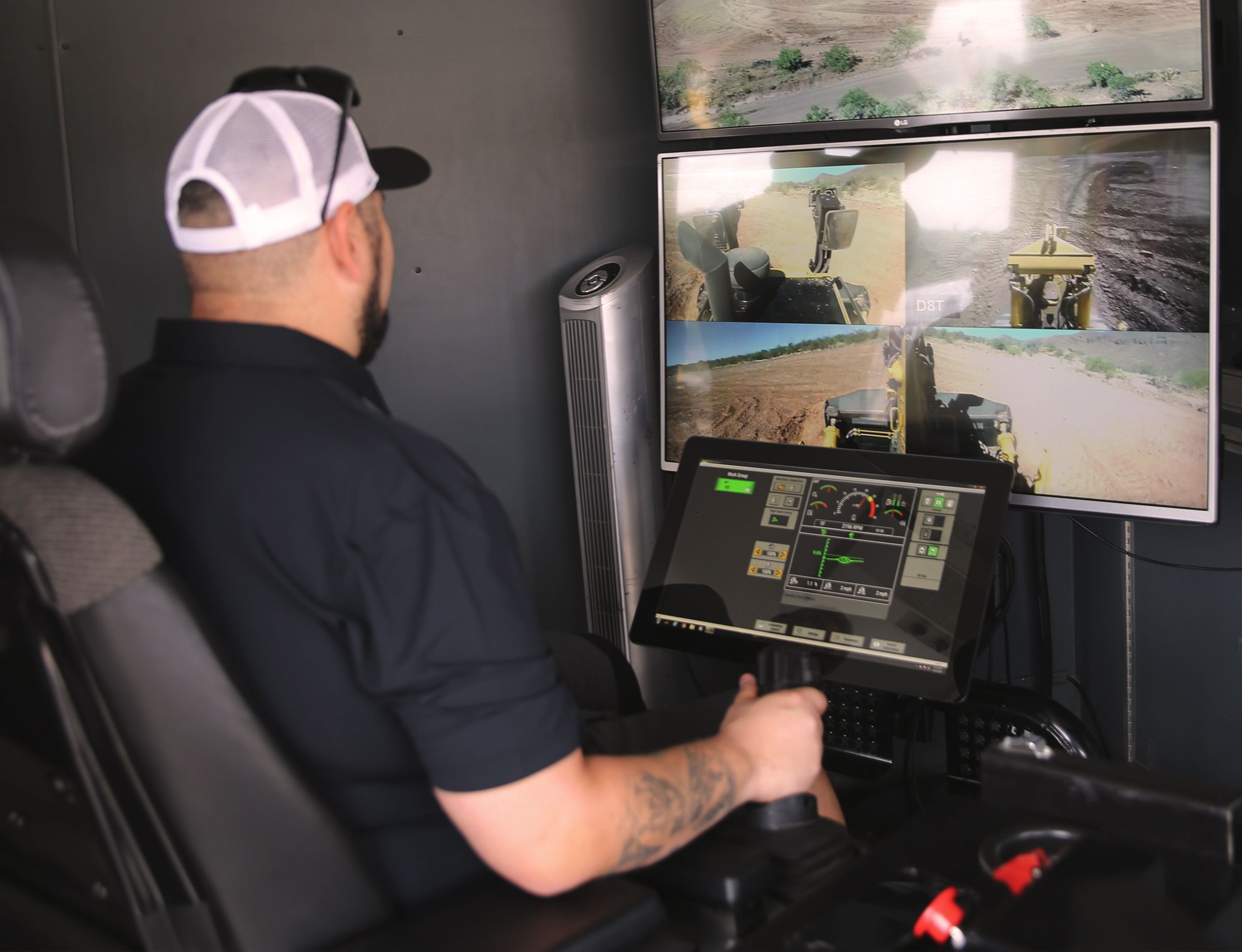 Segs4Vets member operates a Cat® D8T from the Cat Command trailer.