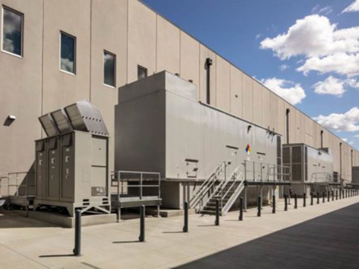 Figure 3: N+2 isolated redundant generators in an exterior walk-in enclosure provide back-up power for a co-location data center.