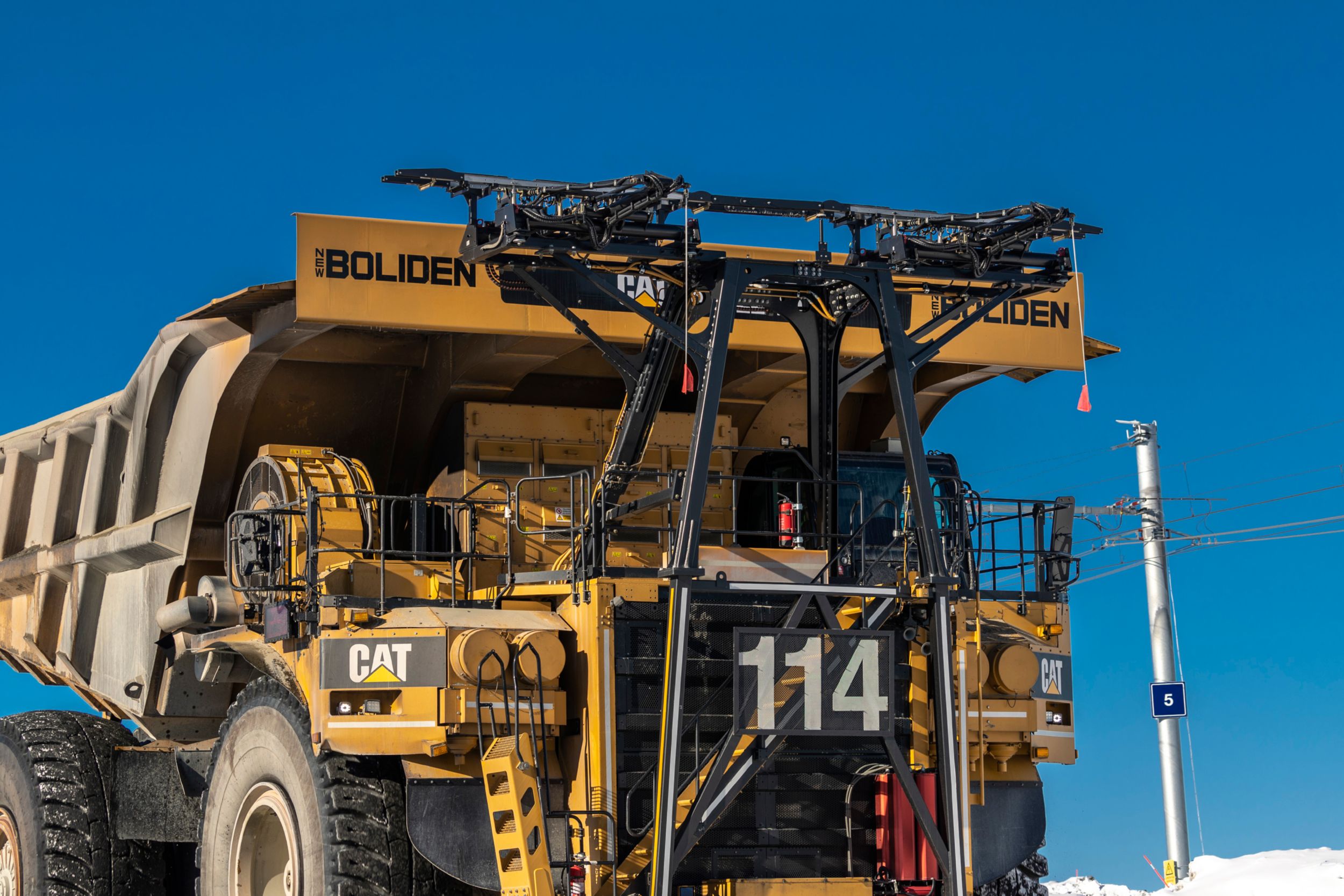 Trolley assist pantograph on Cat 795F AC truck at Boliden Aitik mine.