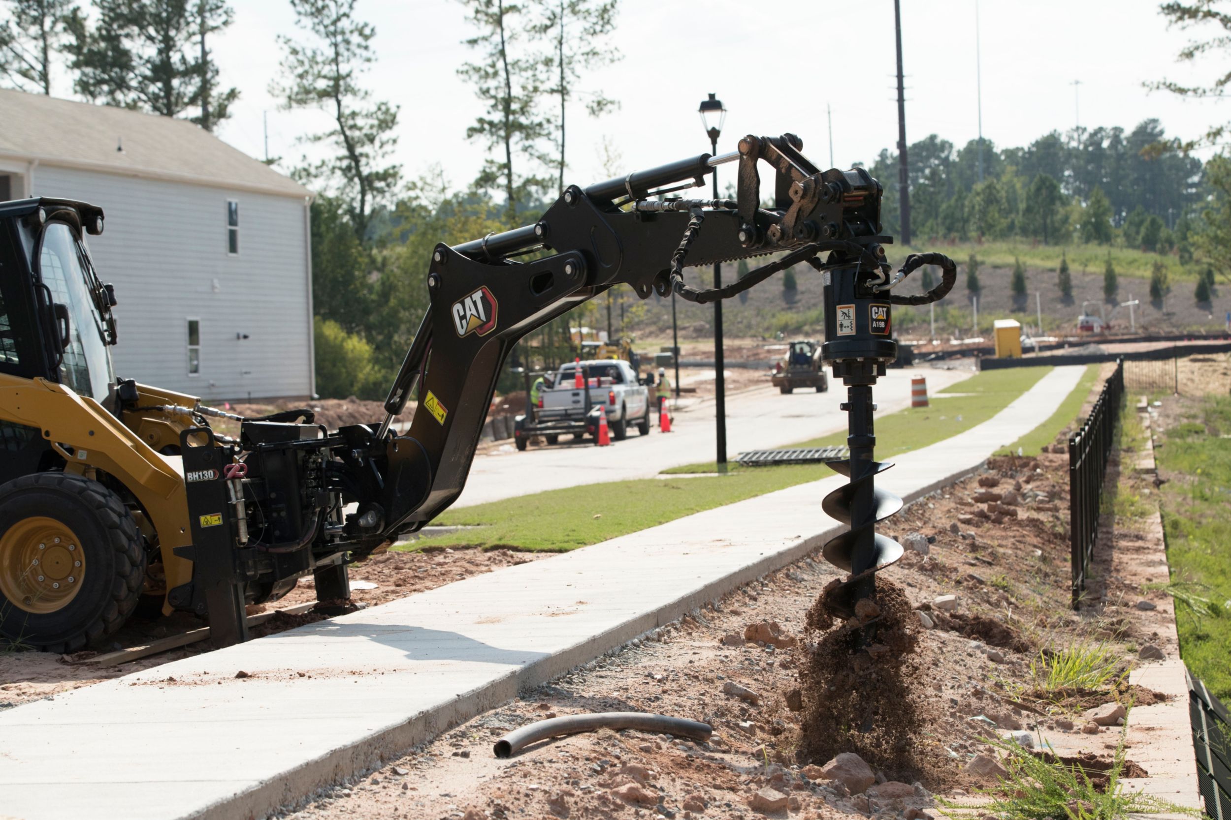 Cat Skid Steer Loader with Backhoe SMART Attachment