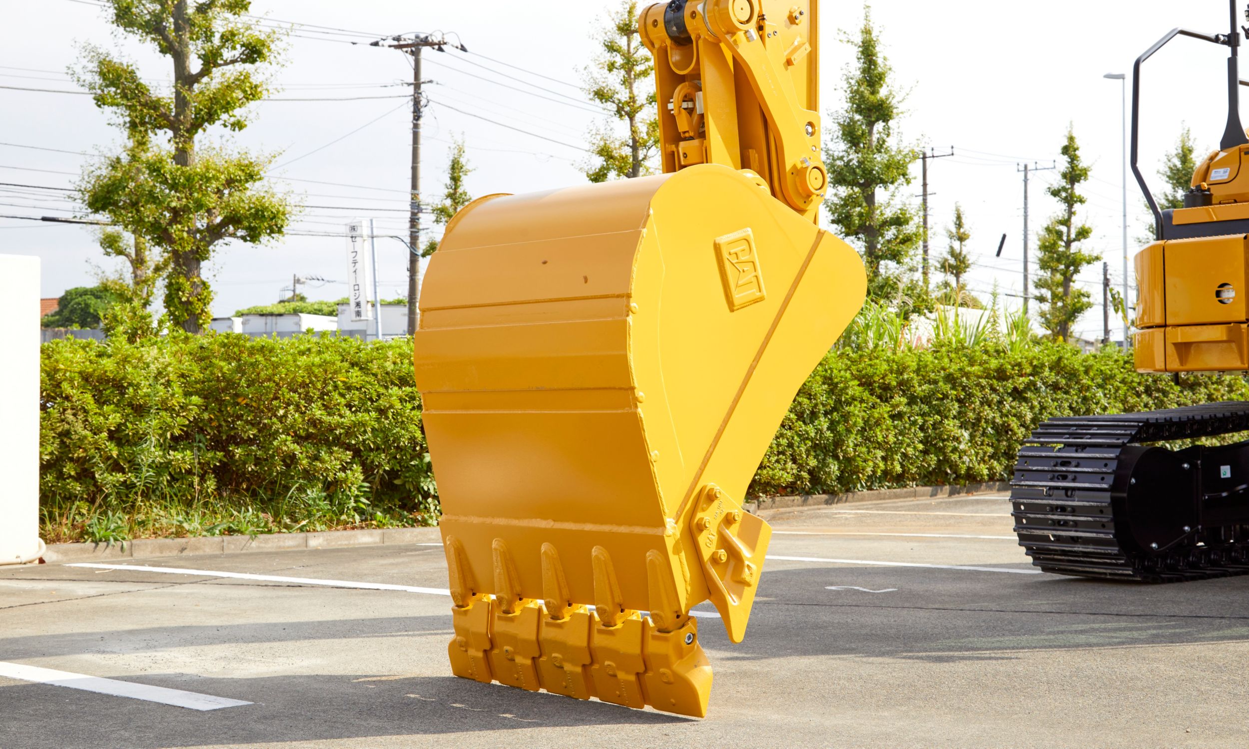 Underside of medium-sized excavator bucket onsite