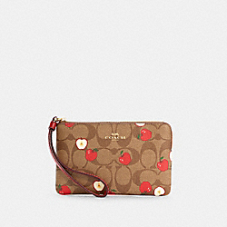 COACH CORNER ZIP WRISTLET IN SIGNATURE CANVAS WITH APPLE PRINT - ONE COLOR - 6979