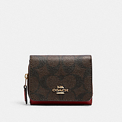 COACH Small Trifold Wallet In Signature Canvas - GOLD/BROWN 1941 RED - 7331