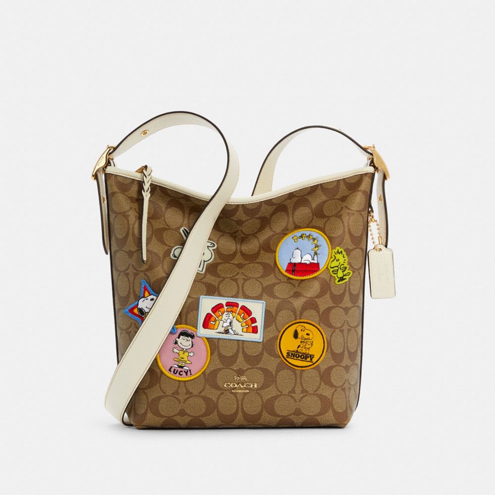COACH COACH X PEANUTS VAL DUFFLE IN SIGNATURE CANVAS WITH VARSITY PATCHES - IM/KHAKI CHALK MULTI - C4112