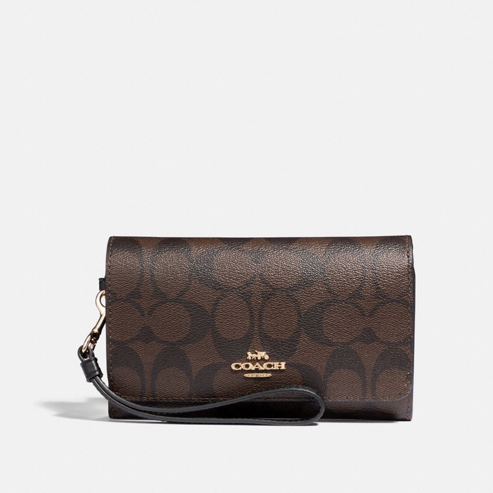 COACH FLAP PHONE WALLET IN SIGNATURE CANVAS - BROWN/BLACK/LIGHT GOLD - F32484