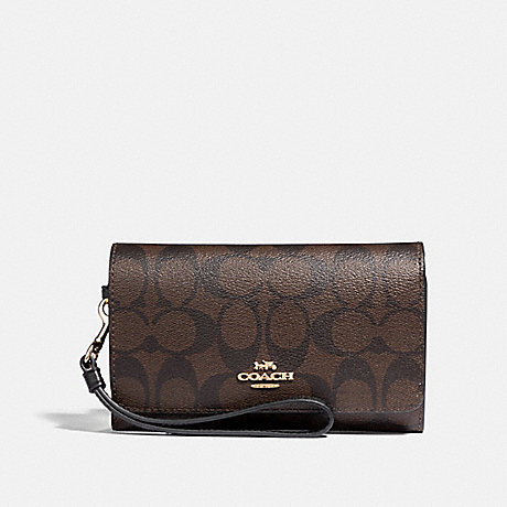 COACH FLAP PHONE WALLET IN SIGNATURE CANVAS - BROWN/BLACK/LIGHT GOLD - F32484