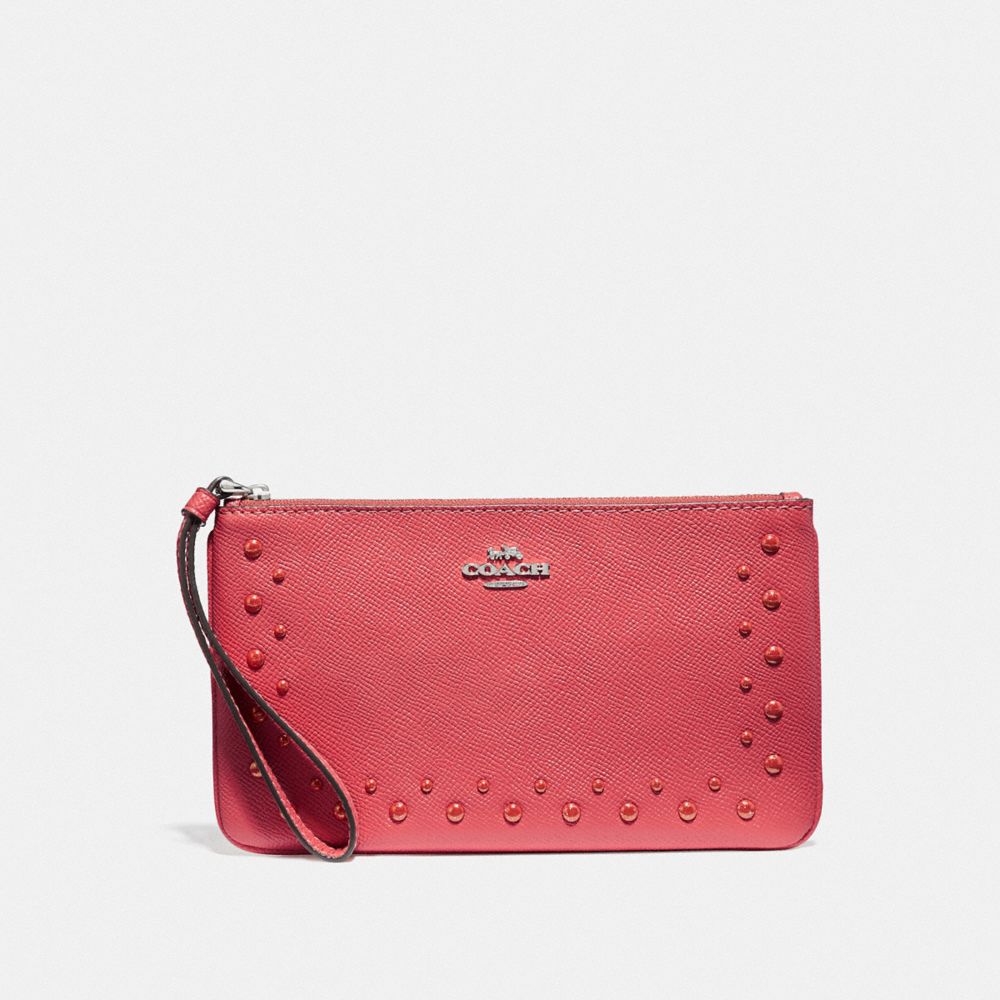 COACH LARGE WRISTLET WITH STUDS - CORAL/SILVER - F67501