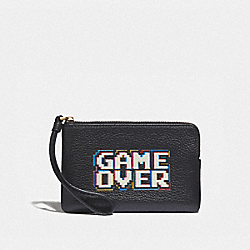 COACH CORNER ZIP WRISTLET WITH PAC-MAN GAME OVER - BLACK/MULTI/GOLD - F73399