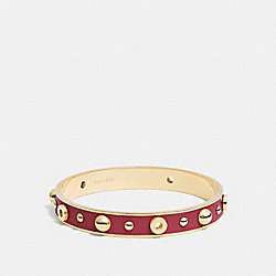 COACH GROMMETS AND RIVETS BANGLE - BLACK CHERRY/GOLD - F90512