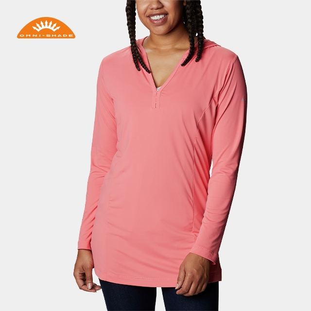 Woman in a hooded sun protection shirt, Omni-Shade logo.