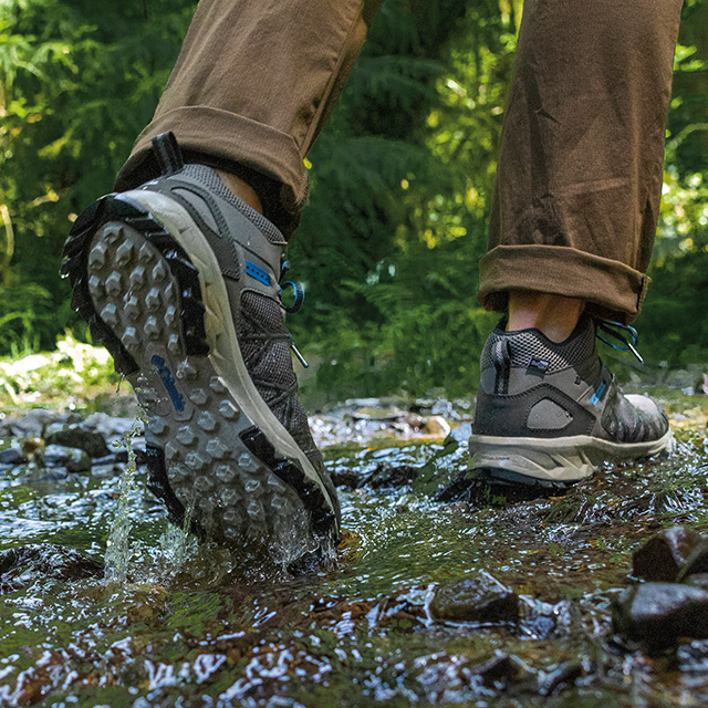 Boots hiking through water