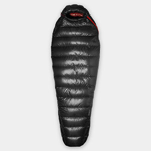 A Mountain Hardwear sleeping bag, black on the exterior, red on the interior.