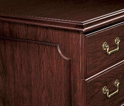 Rich wood moldings, brass-finished hardware.