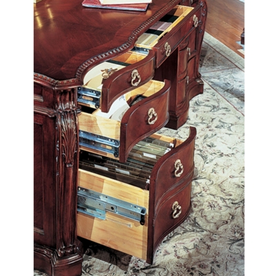 Desk features a center pencil tray. Each pedestal has two box drawers and one locking letter/legal file drawer.