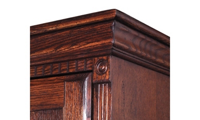 Subtle distressed detail includes rosettes, crown dentil moldings and fluted railings