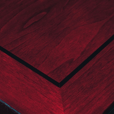 Hand-cut, hand-spliced, Ebony banding inlay on all work surfaces.