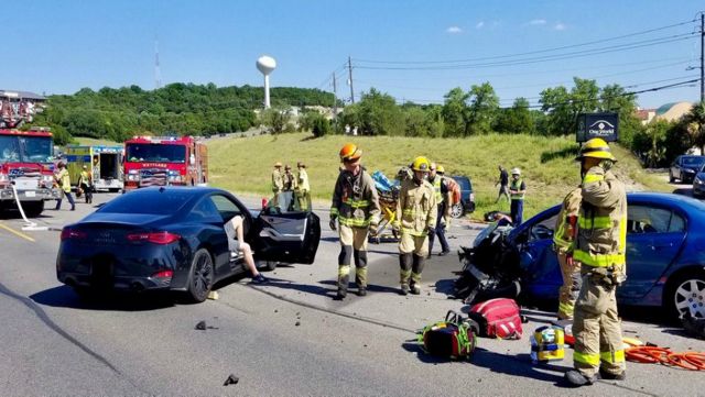 EMS crews respond to a collision involving a trapped person on FM 2244.