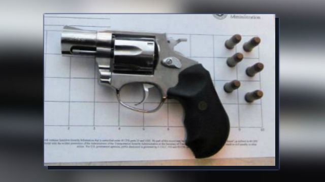 Woman arrested at Rochester airport after loaded gun found