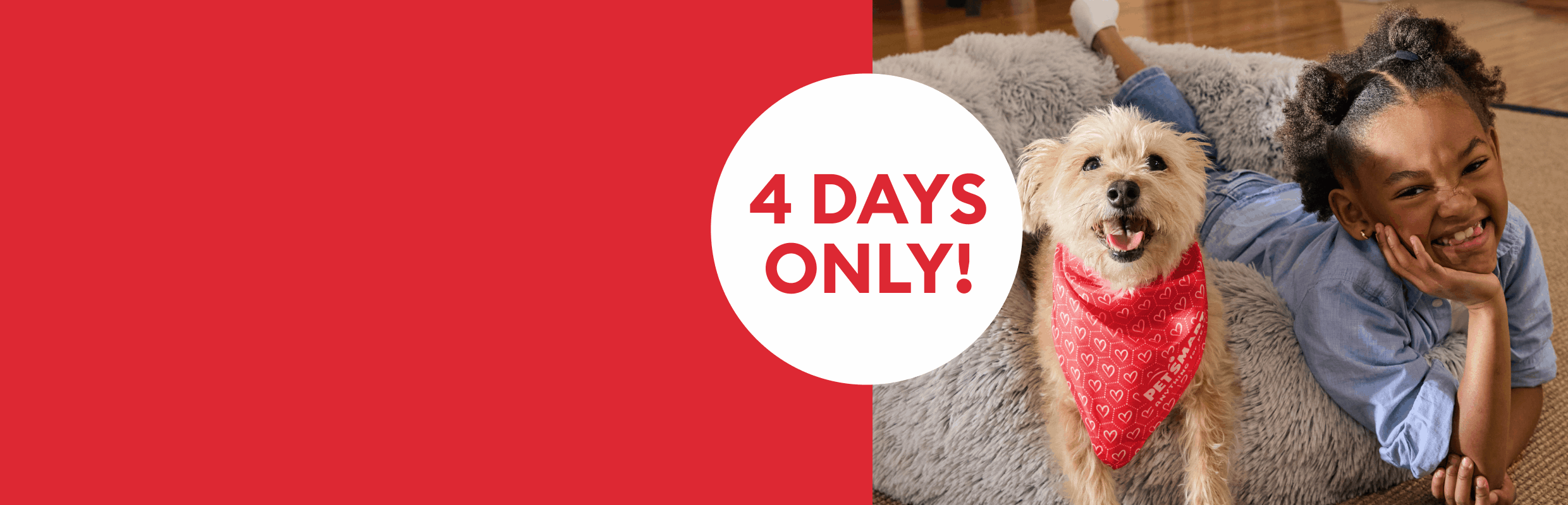 Smiling child lying next to dog in red bandana with ‘4 days only’ callout