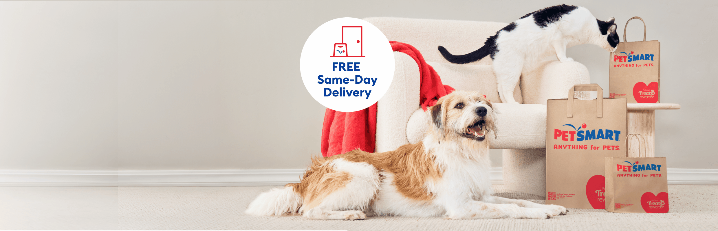 Dog & cat next to PetSmart shopping bags, with the callout, Now you choose, FREE Same-Day Delivery, Store Pickup, Ship to Home