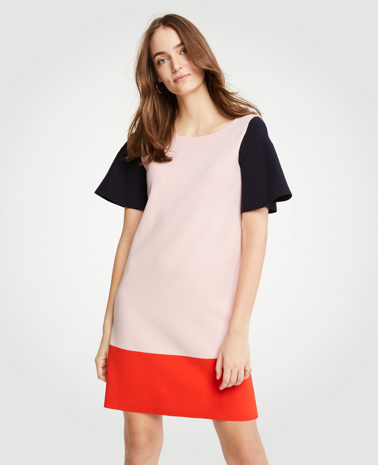 Bold, blocked and styled with confidence, this graphic standout merges clean lines with high impact color. Jewel neck. Short sleeves. 35 from shoulder to hem.