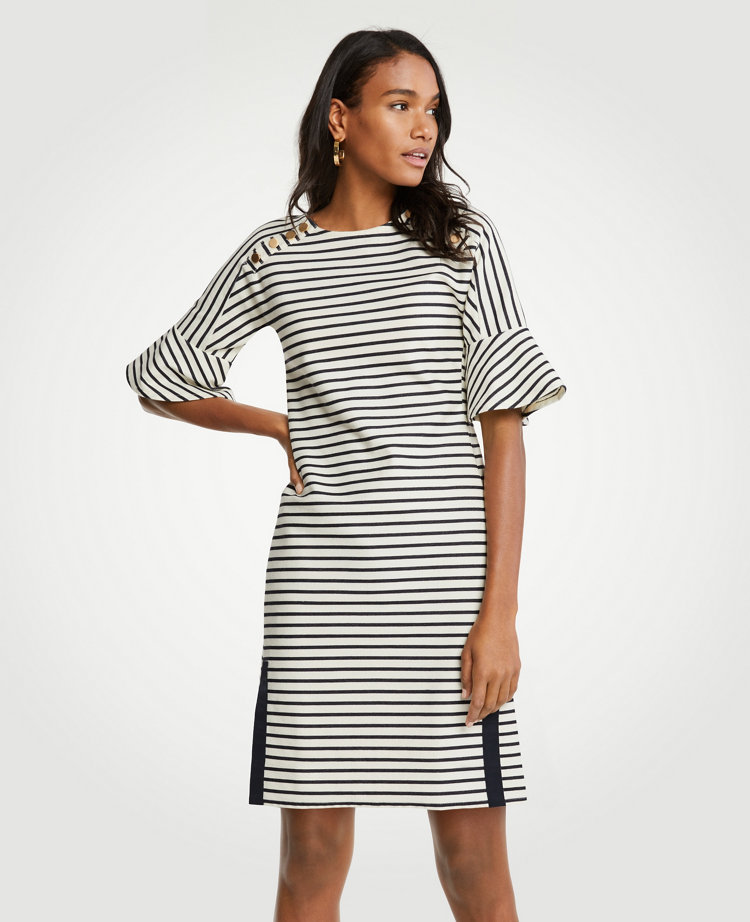 Punctuated with button detail, our fluted sleeve shift dress is nautically striped for a clean and classic look. Crew neck. Short sleeves. Grosgrain side slits. 21 1/2 from natural waist.