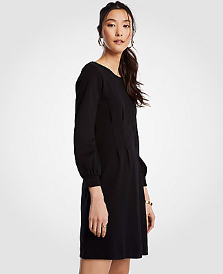 Meet your real-life uniform: this is Luxewear. Every day. Every wear. Ingeniously tailored with corset-inspired pleats at the bodice, this rich doubleface style is a modern mix of sporty and sweet. Jewel neck. Long sleeves with shirred cuffs. Waist pleats. Hidden back zipper with hook-and-eye closure. 20 from natural waist.