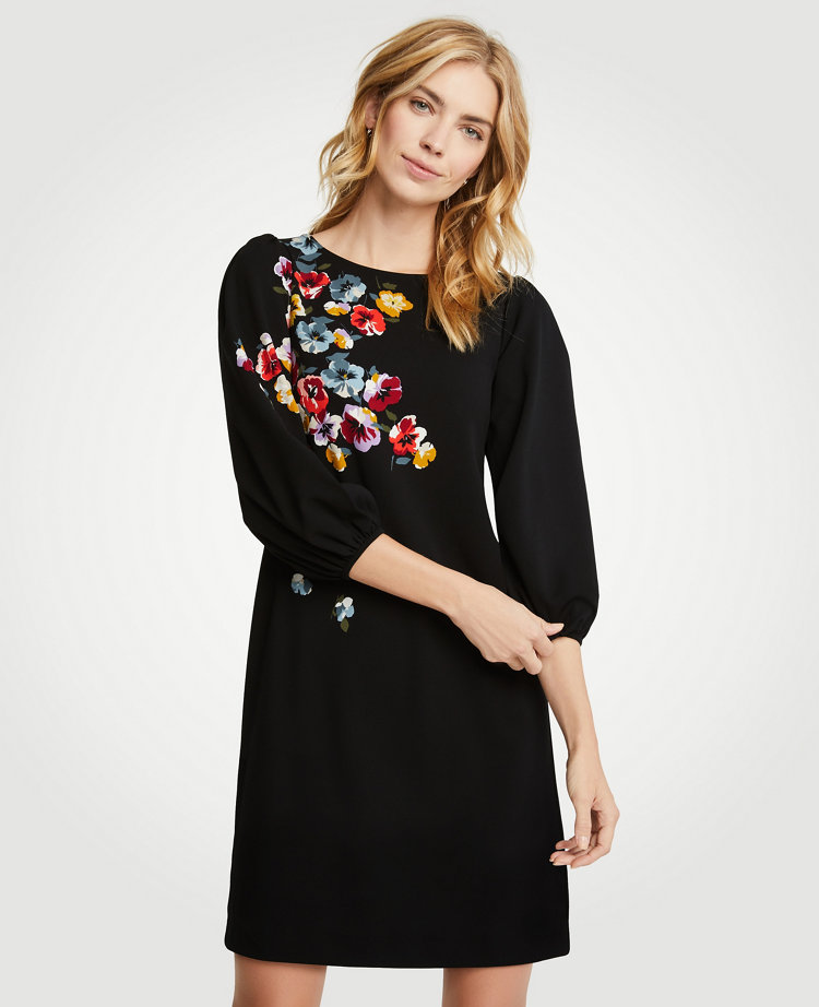 Inspired by spring's freshest blooms, our balloon sleeve shift is flourished with perfectly-placed florals in rich, romantic hues. Jewel neck. 3/4 sleeves with shirred sleeve caps and cuffs. 18 1/2 from natural waist.