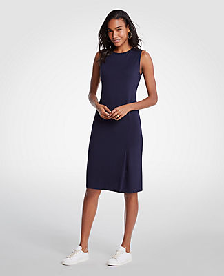 Meet your real-life uniform: this is Luxewear. An asymmetric pleated skirt lends an alluring slant to this smooth ponte sheath. Jewel neck. Sleeveless. 39 1/2 from shoulder to hem.